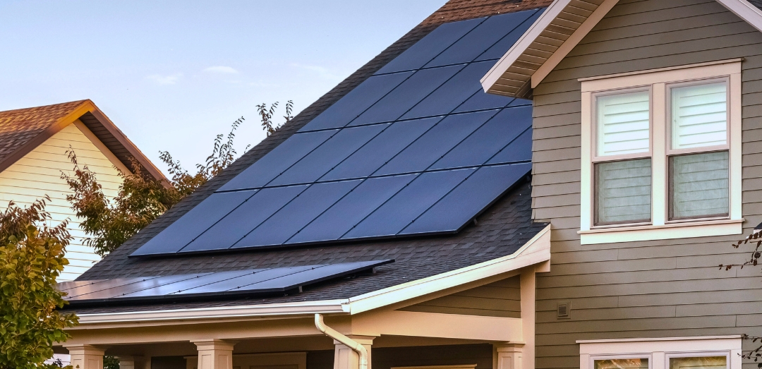 modern two story home roof with solar panels