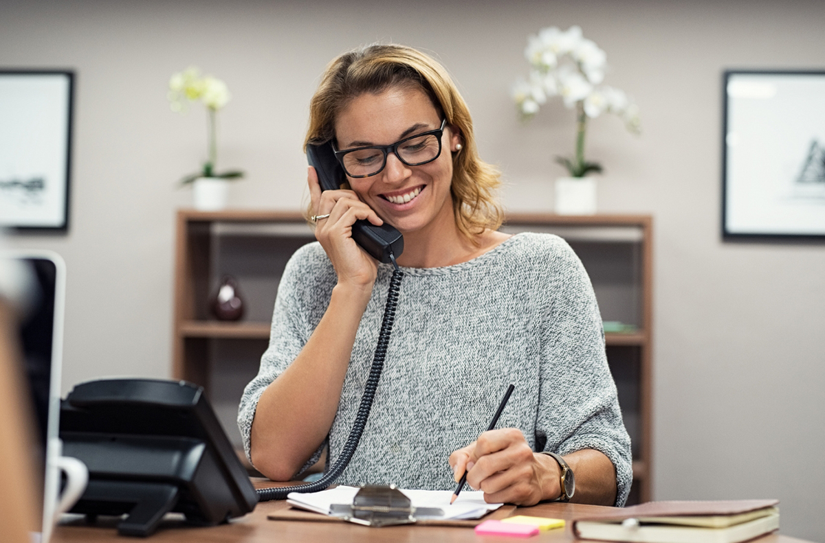 woman in office on phone consultation zero waste